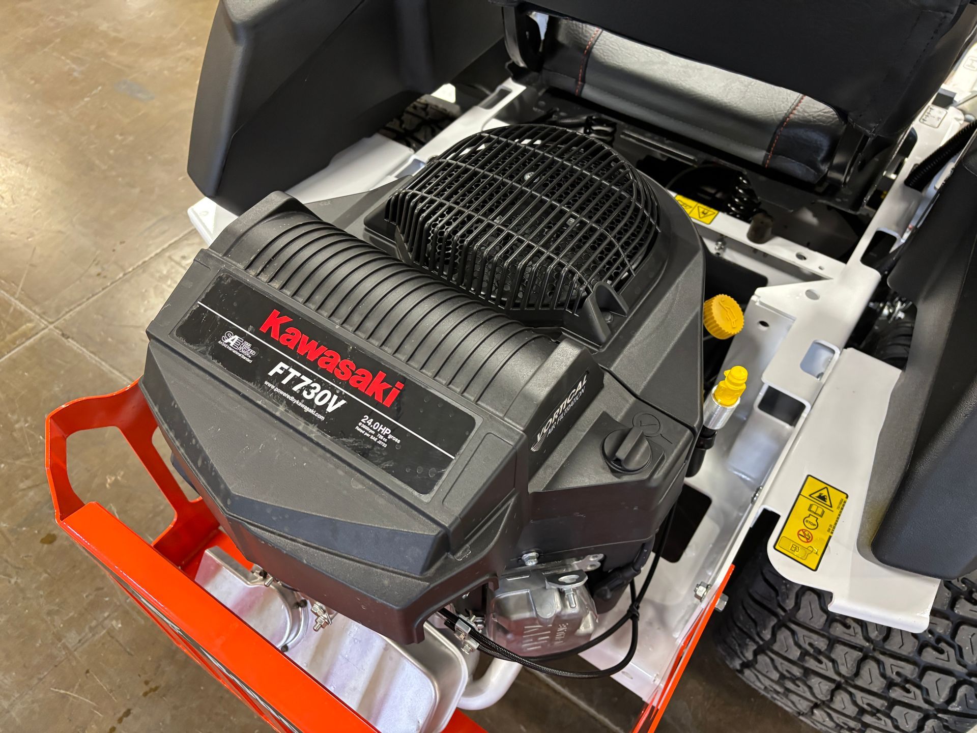 Kawasaki FT730V engine in a zero-turn lawn mower, with a black and red color scheme.