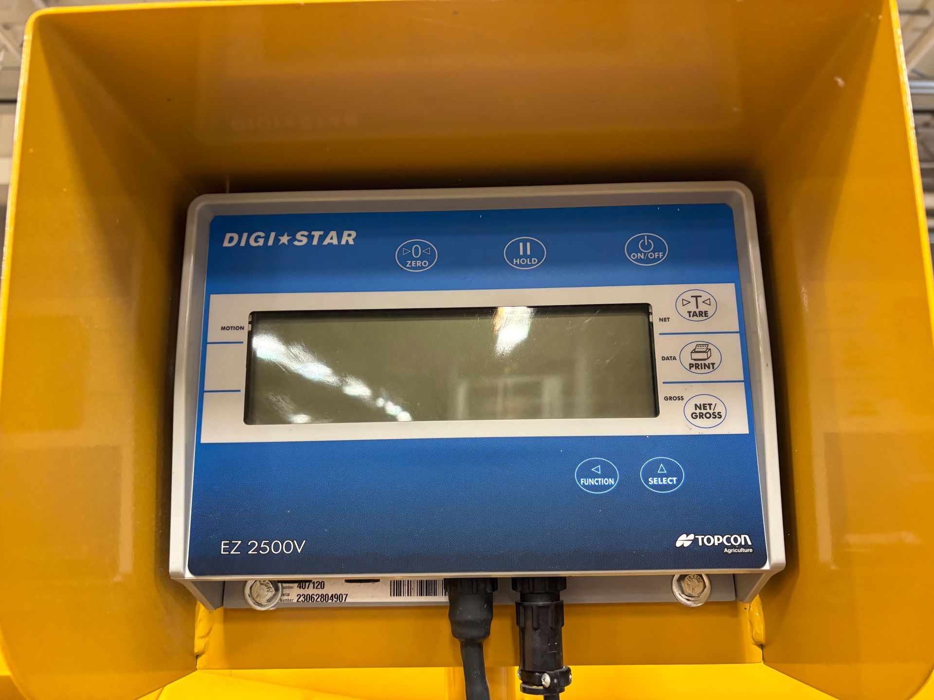Blue and gray Digi-Star EZ 2500N display screen in a yellow protective case, with buttons.