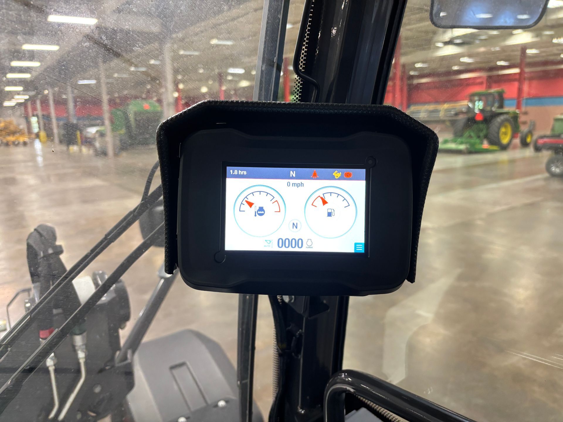 Dashboard in vehicle cabin displays gauges: speed, RPM, and other vehicle data.