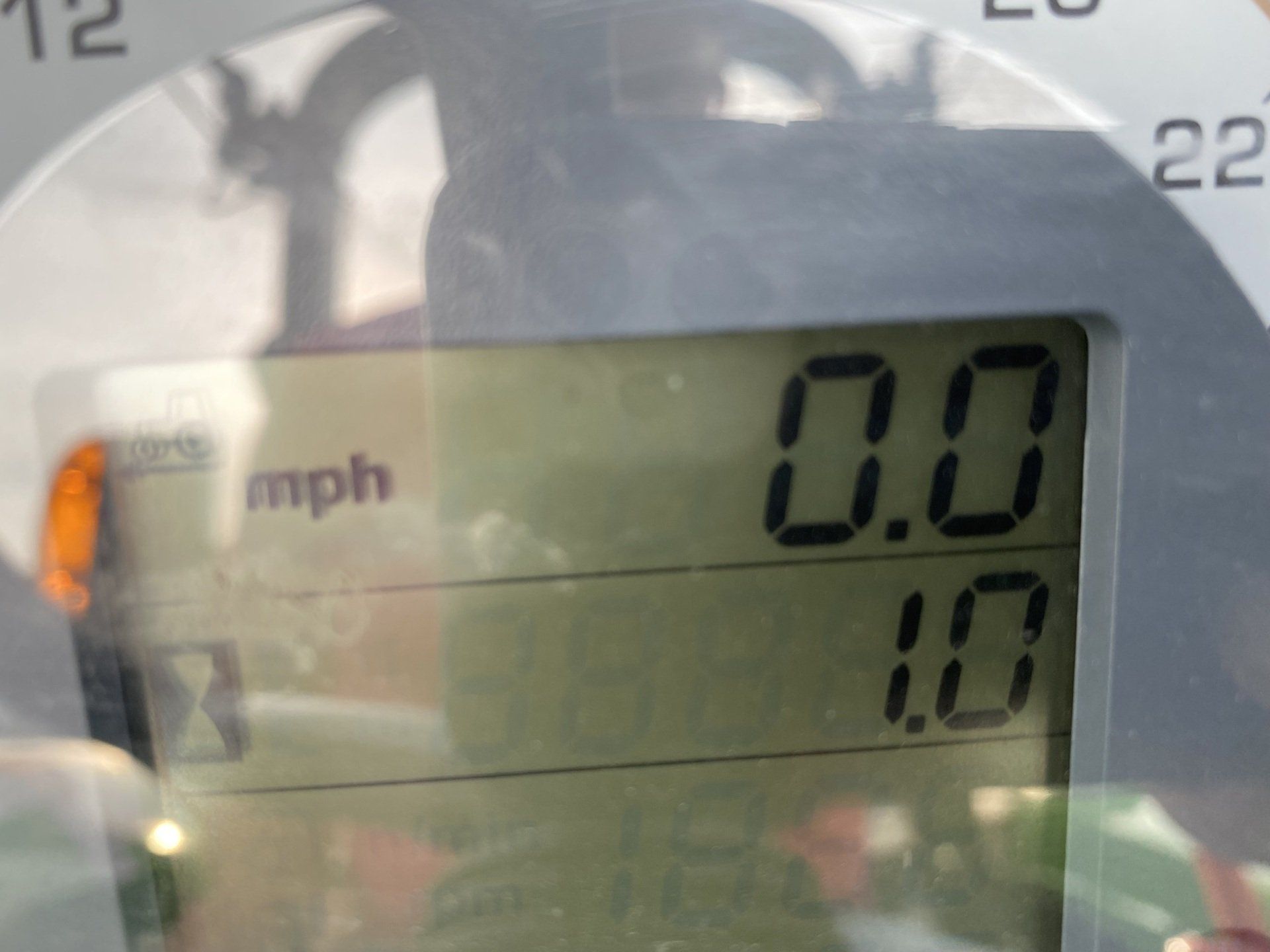 Speedometer displaying 0.0 mph and 1.0. The digital display is set against a blurry background.