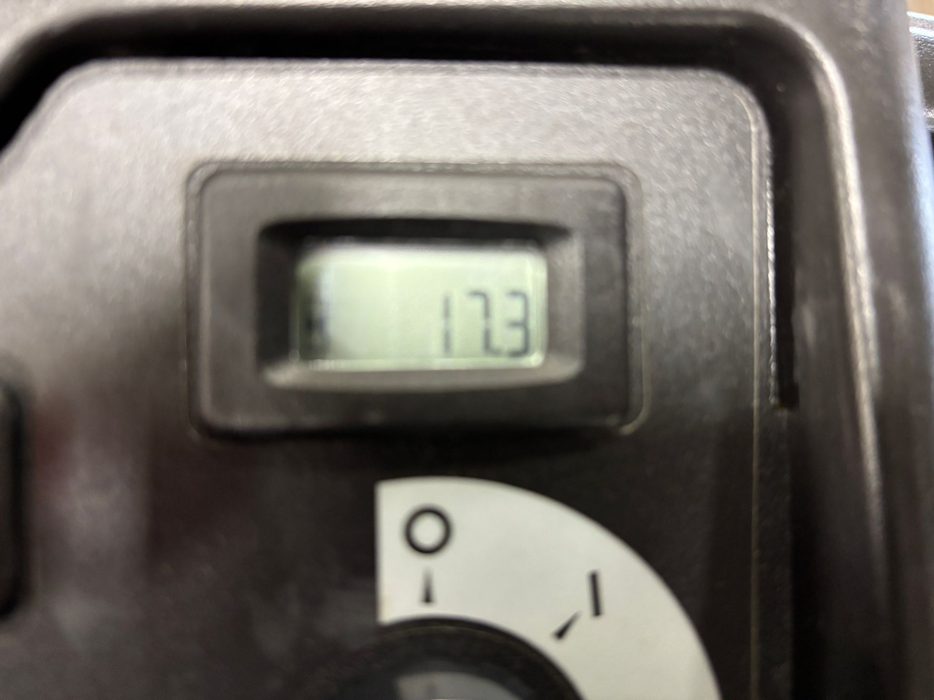 Digital display showing the number 17.3 within a square, black-framed casing.