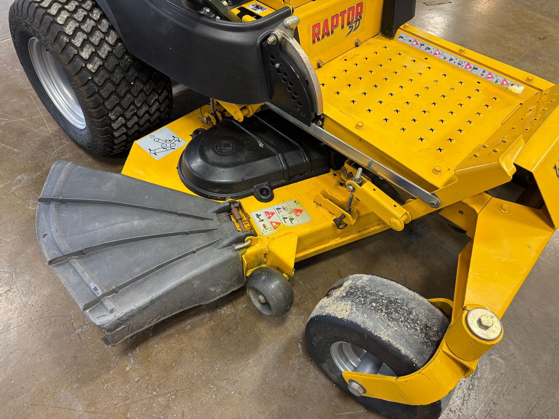 Yellow zero-turn lawnmower, 