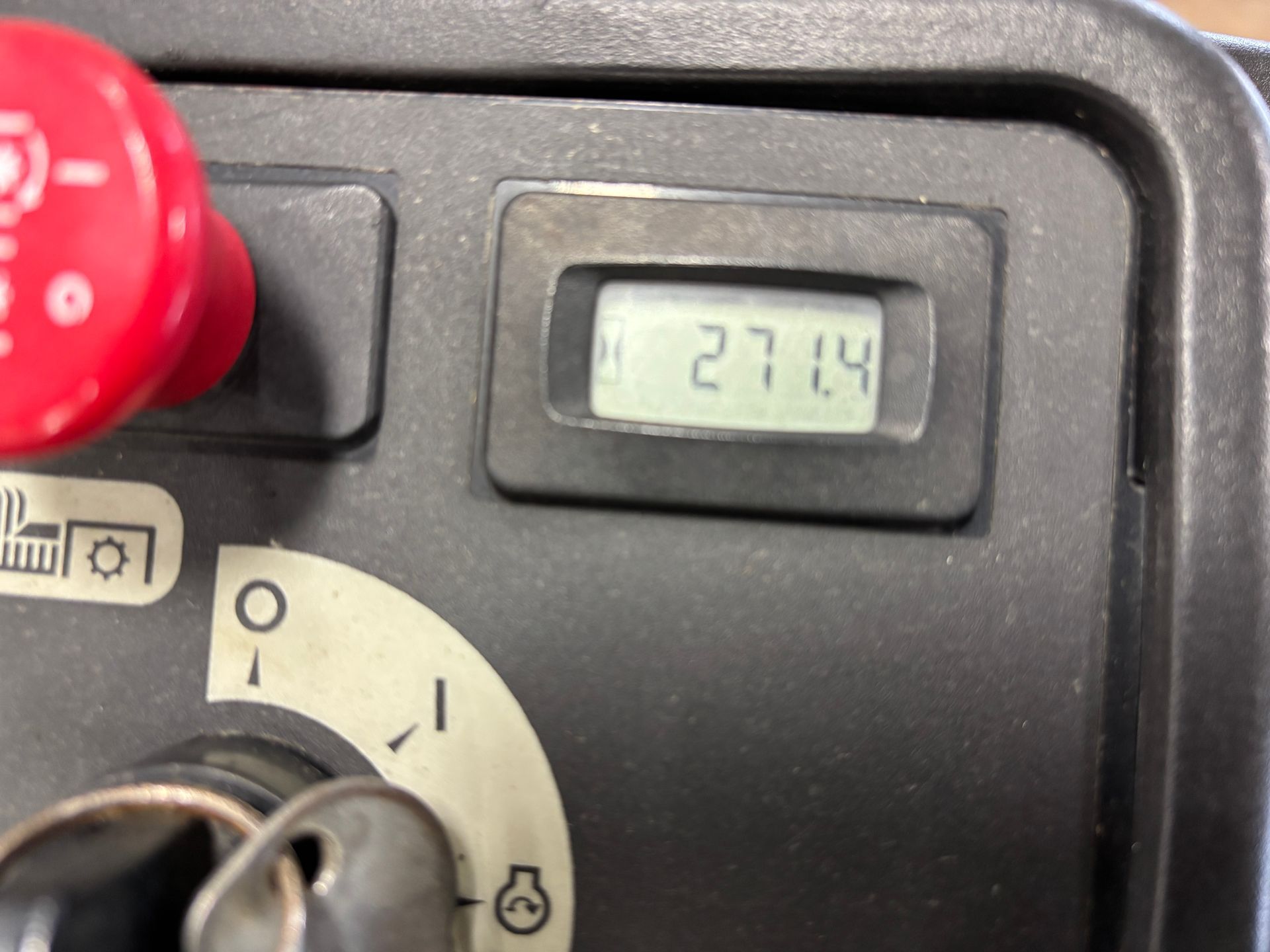 Control panel with hour meter reading 271.4, red button, and key.