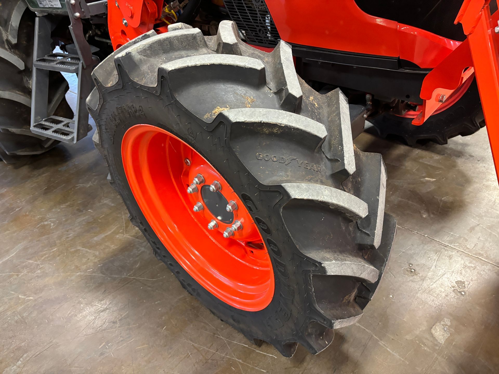 Orange tractor tire with a black tread.