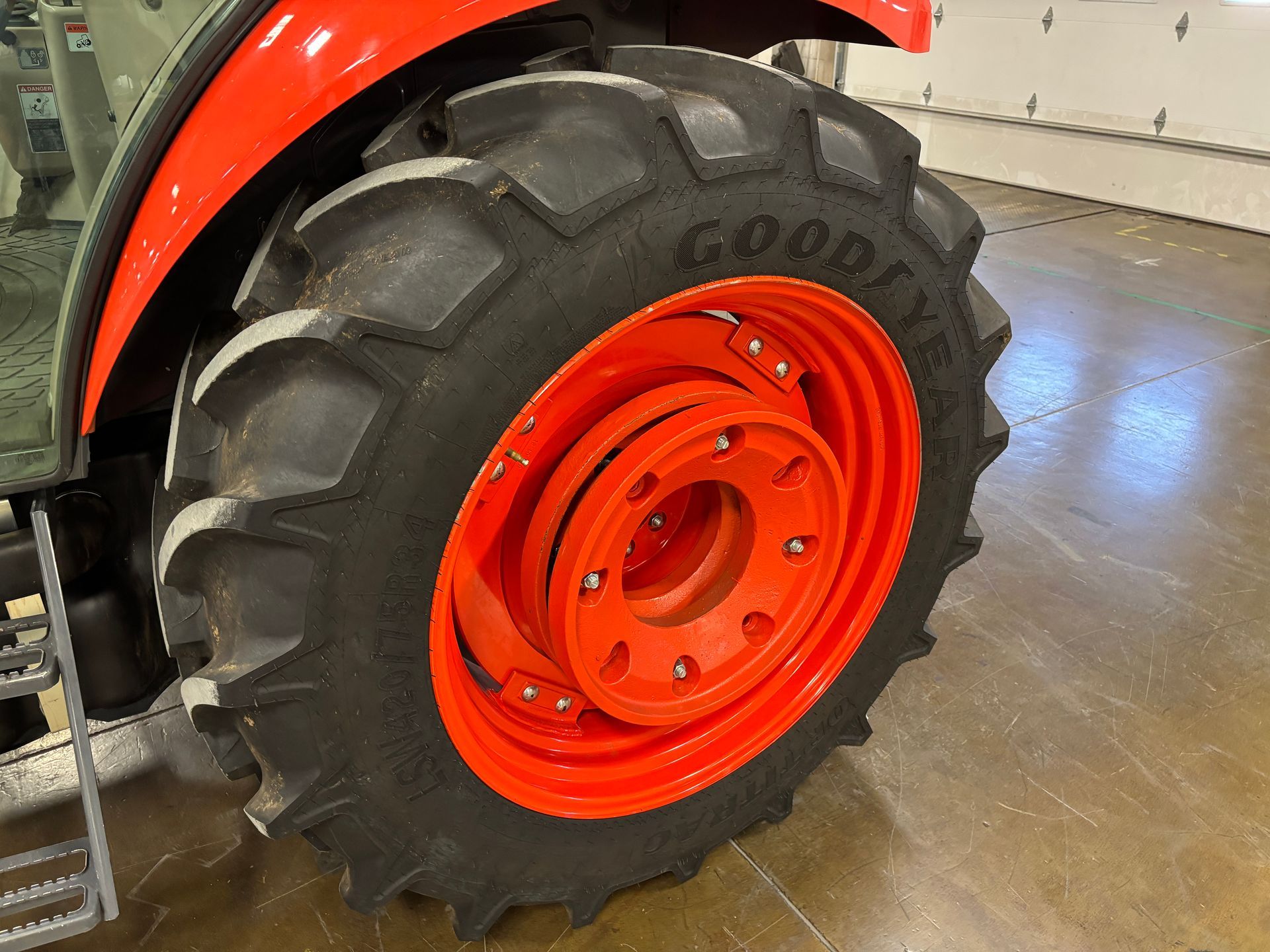 Red tractor wheel and tire.