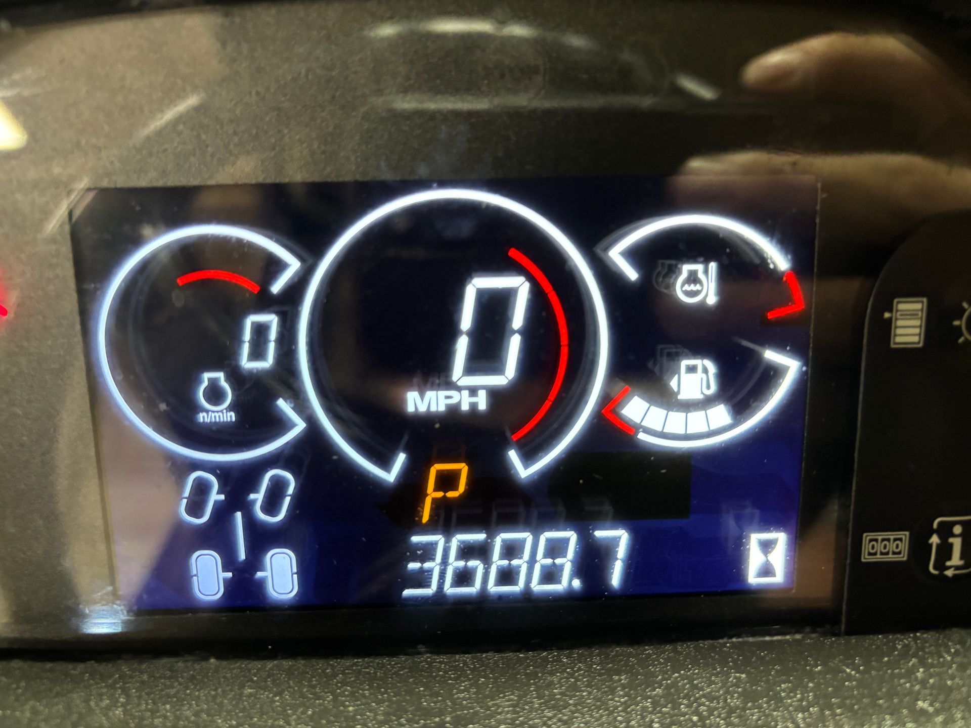 Dashboard display showing 0 MPH, P (Park), and 3688.7 miles. Fuel, oil, and indicator lights are visible.