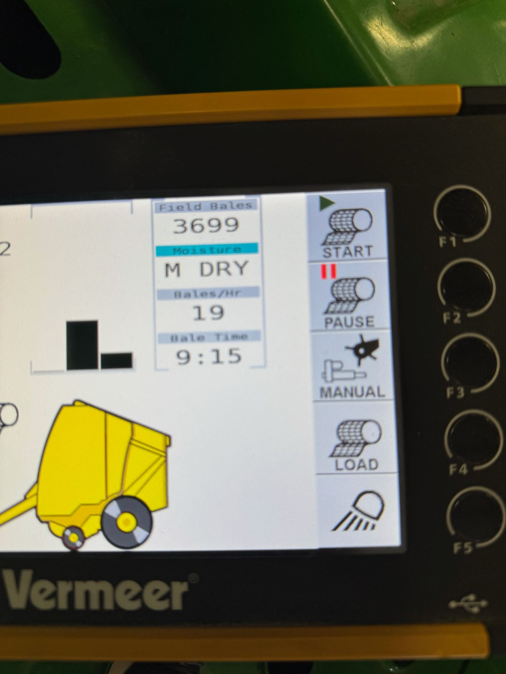 Display of a Vermeer baler control panel showing bale count, moisture, and settings.