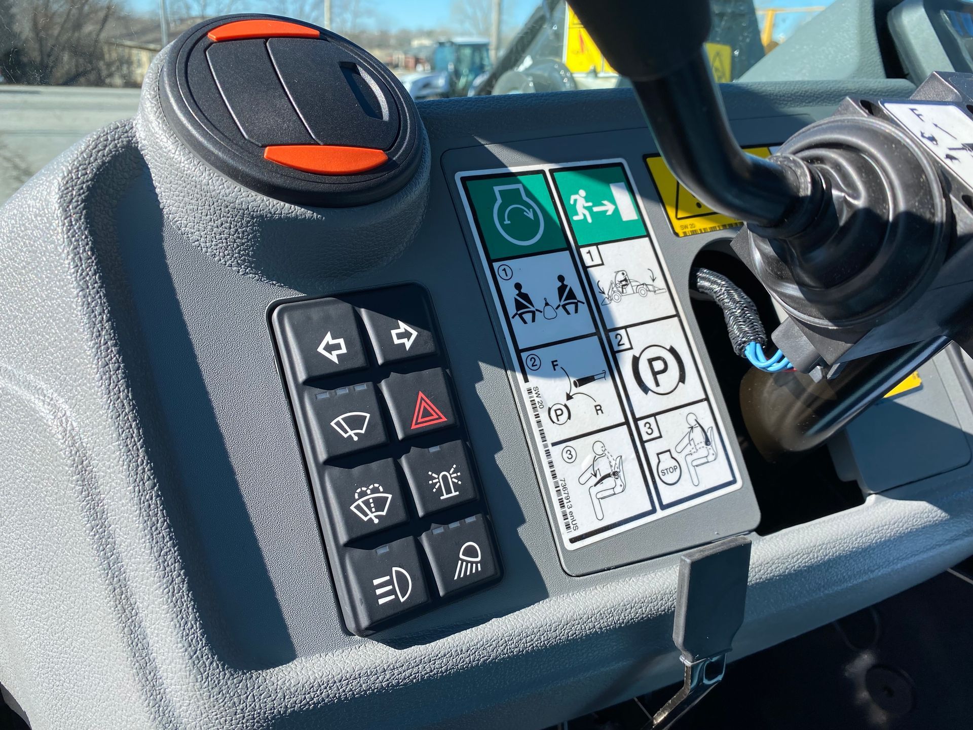 Dashboard with buttons and symbols inside a heavy-duty vehicle.