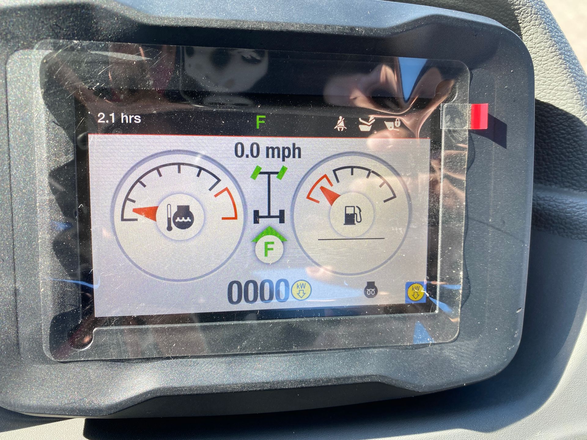 Dashboard with gauges displaying speed, fuel level, and other vehicle information. The speed is 0.0 mph.
