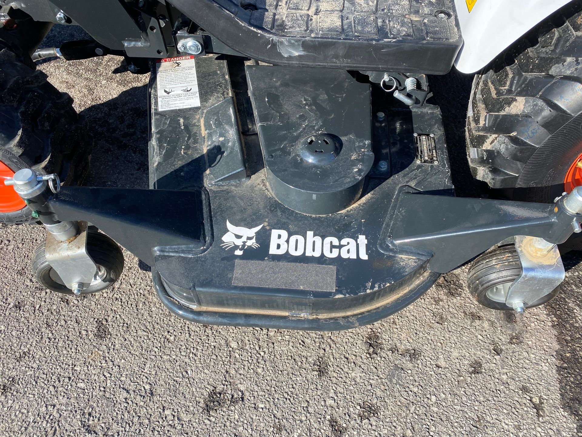 Bobcat riding lawn mower deck with three wheels and the Bobcat logo.