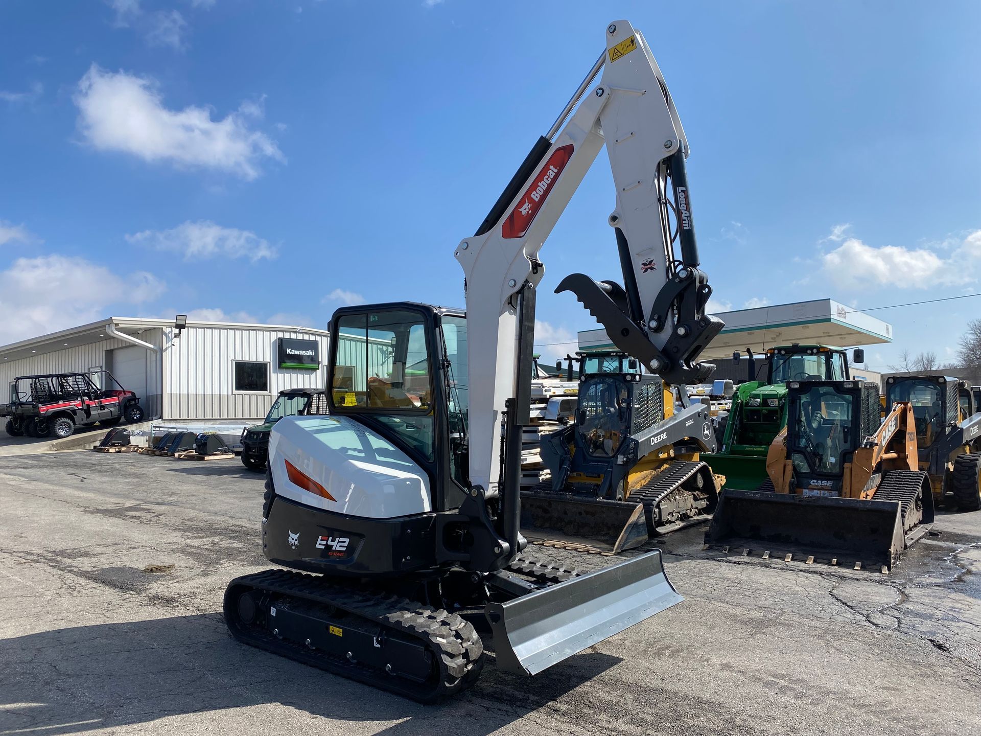 Bobcat excavator on a sunny day at an equipment lot.