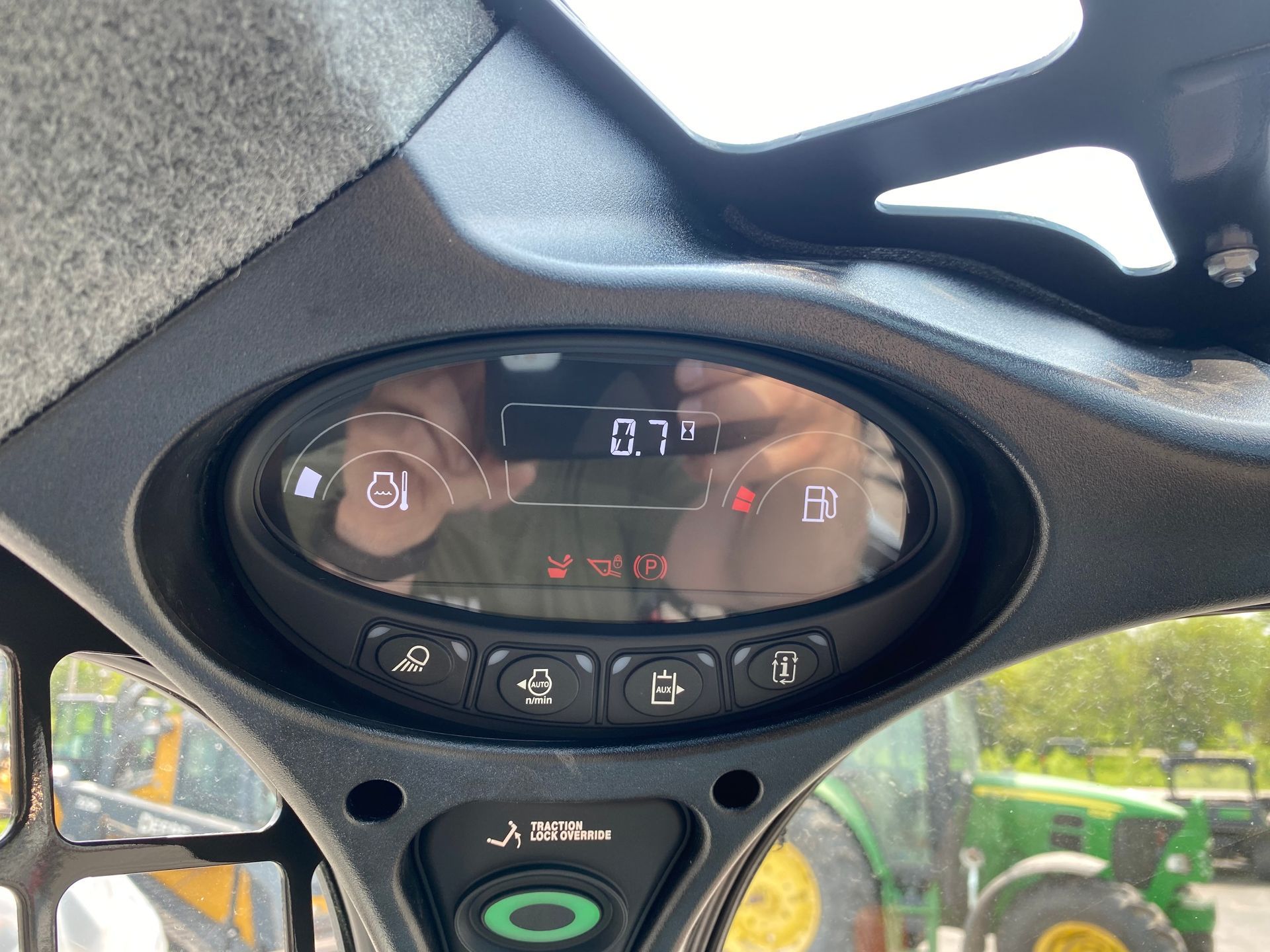Dashboard of a construction vehicle showing fuel and other operational indicators.