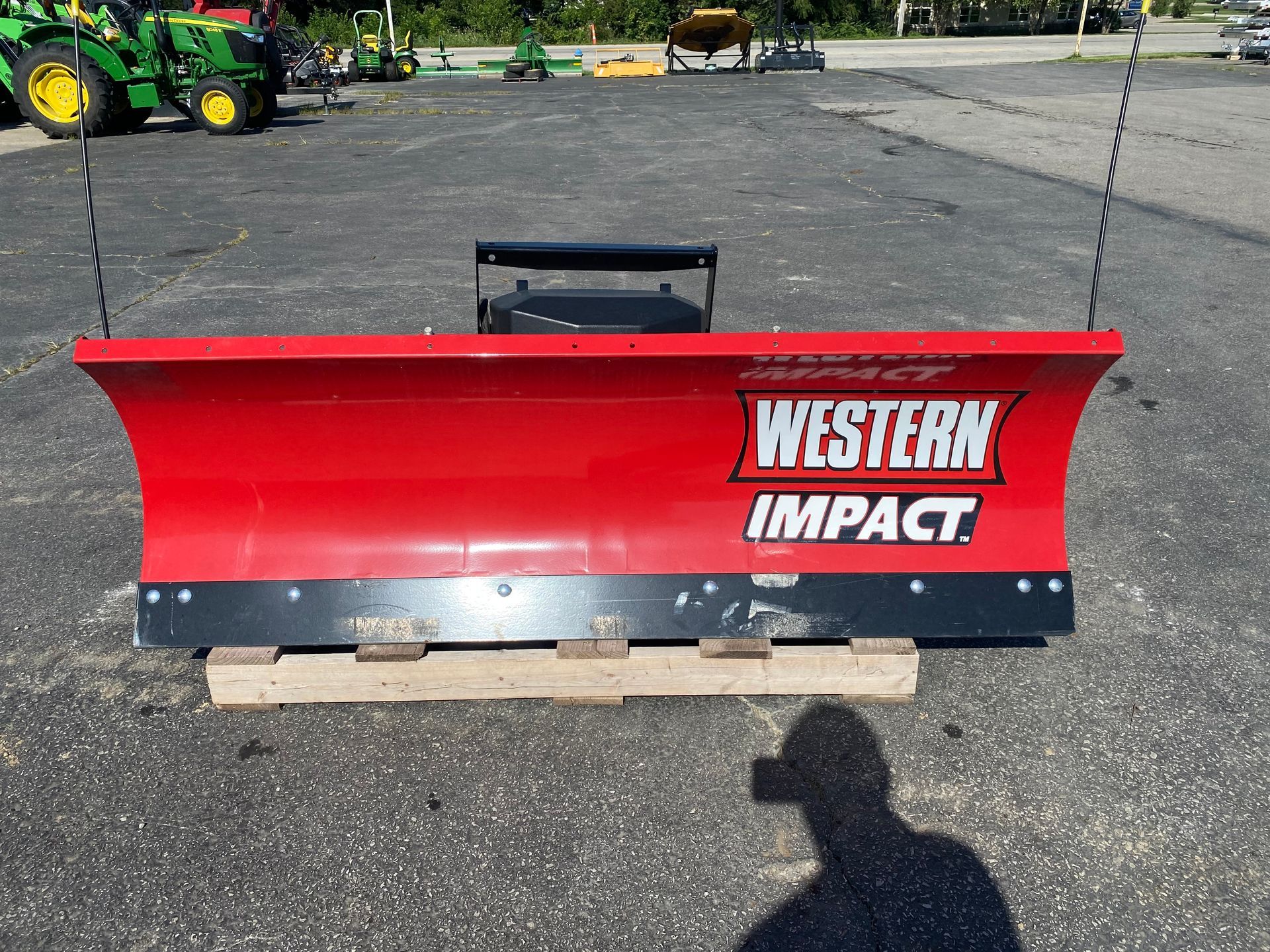 Red Western Impact blade on a pallet, outdoors, front shot.
