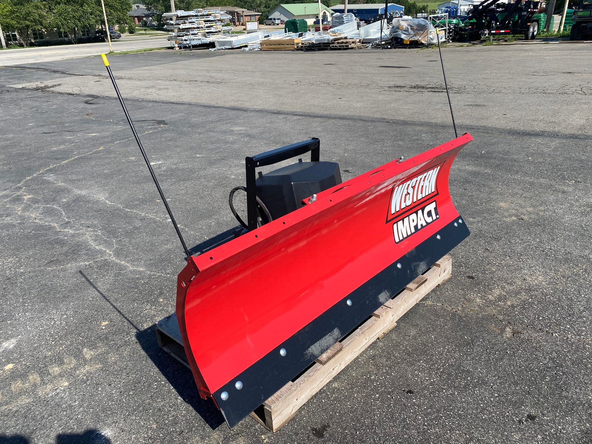 Red Western Impact blade on a pallet, outdoors, front angled shot.