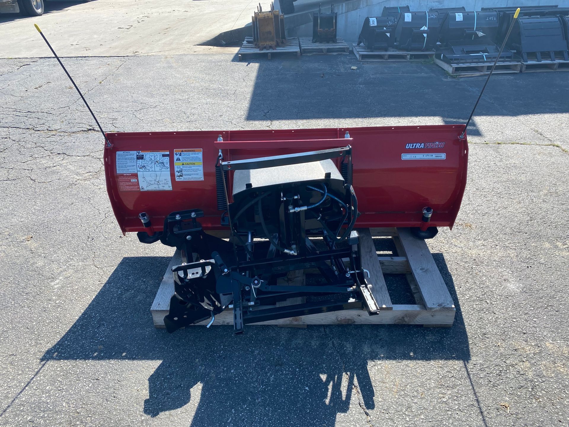 Red Western Impact blade on a pallet, outdoors, back shot.