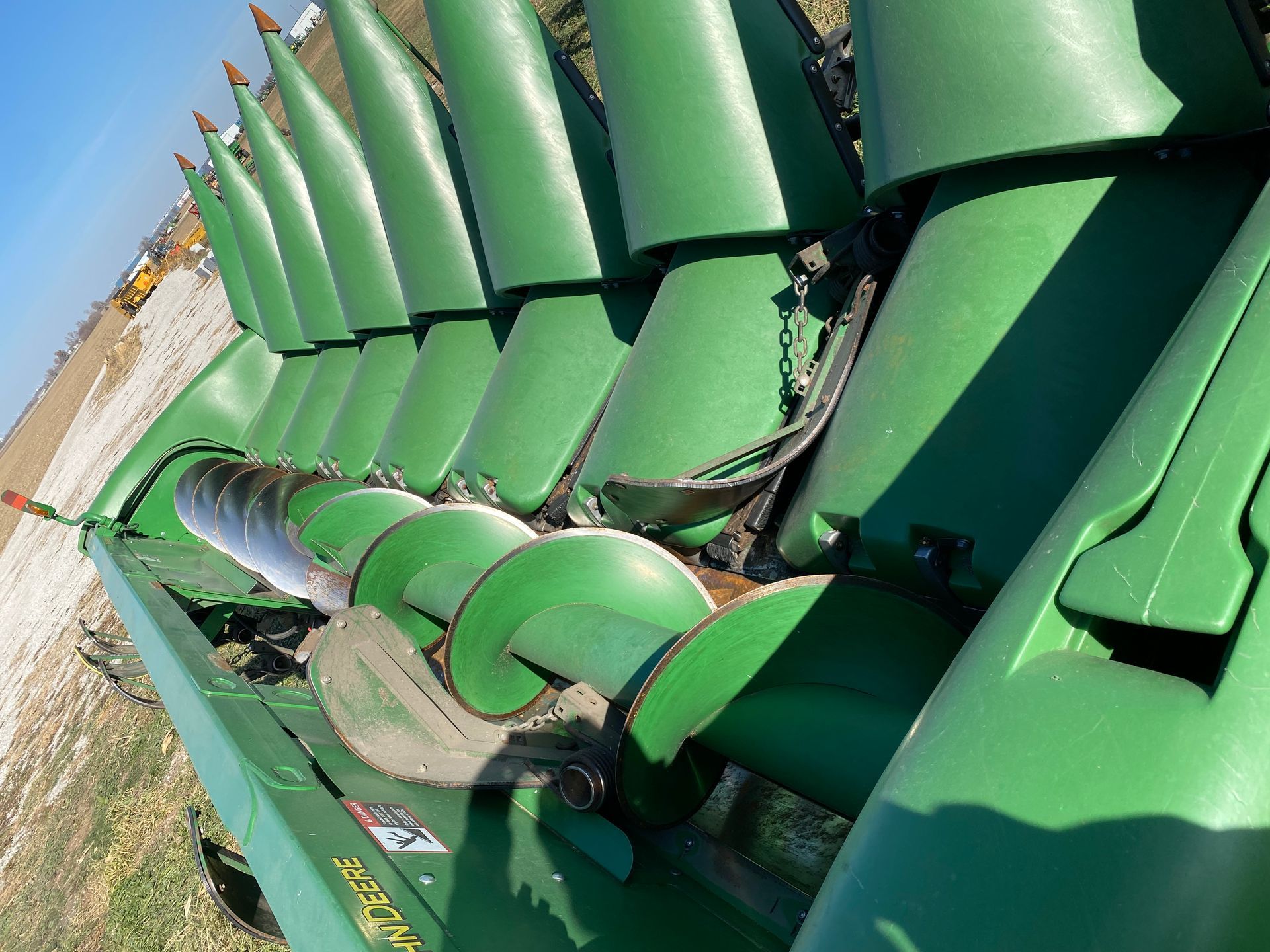 Green John Deere corn head