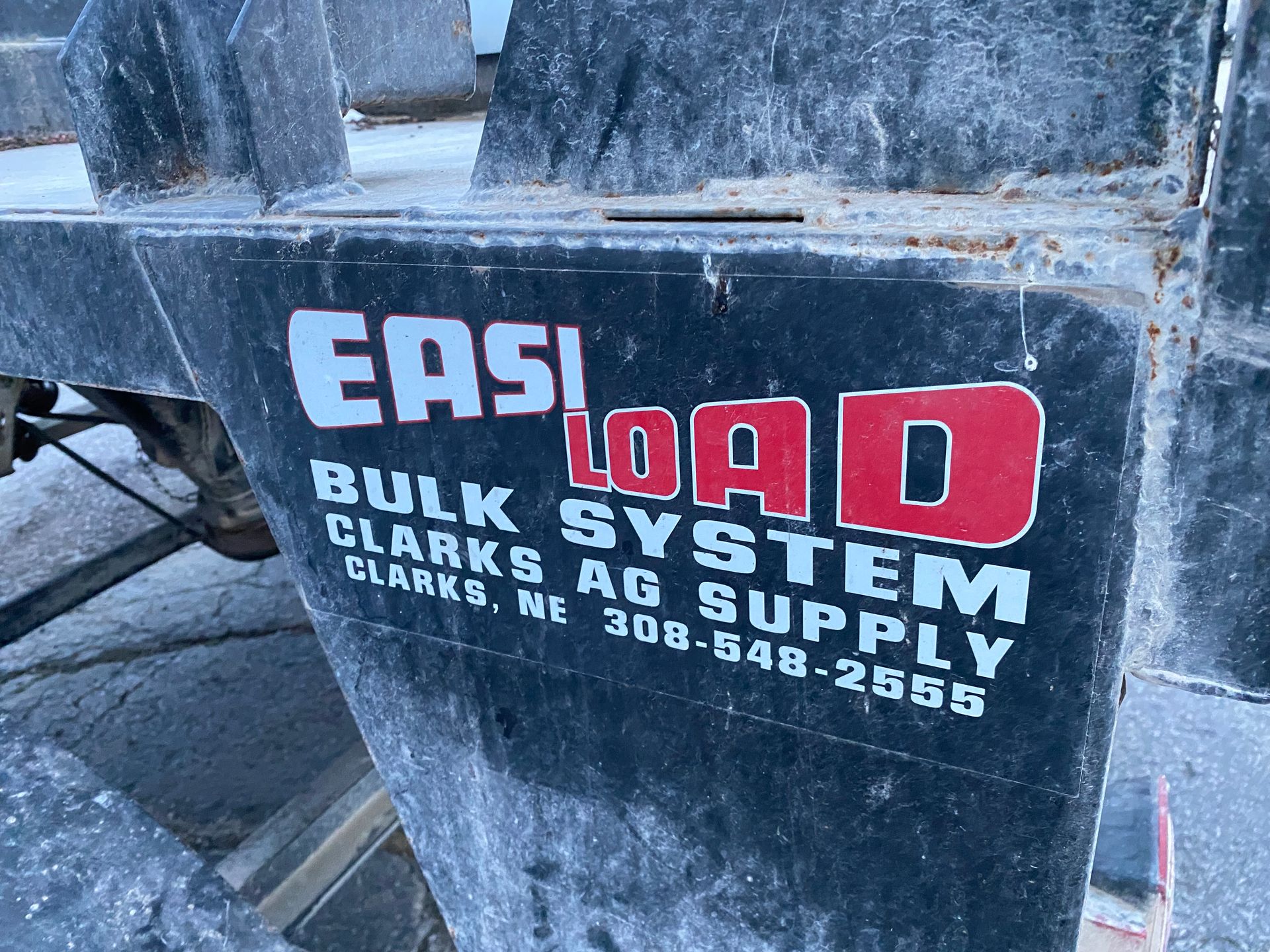 Close-up of a black farm equipment panel, displaying the 