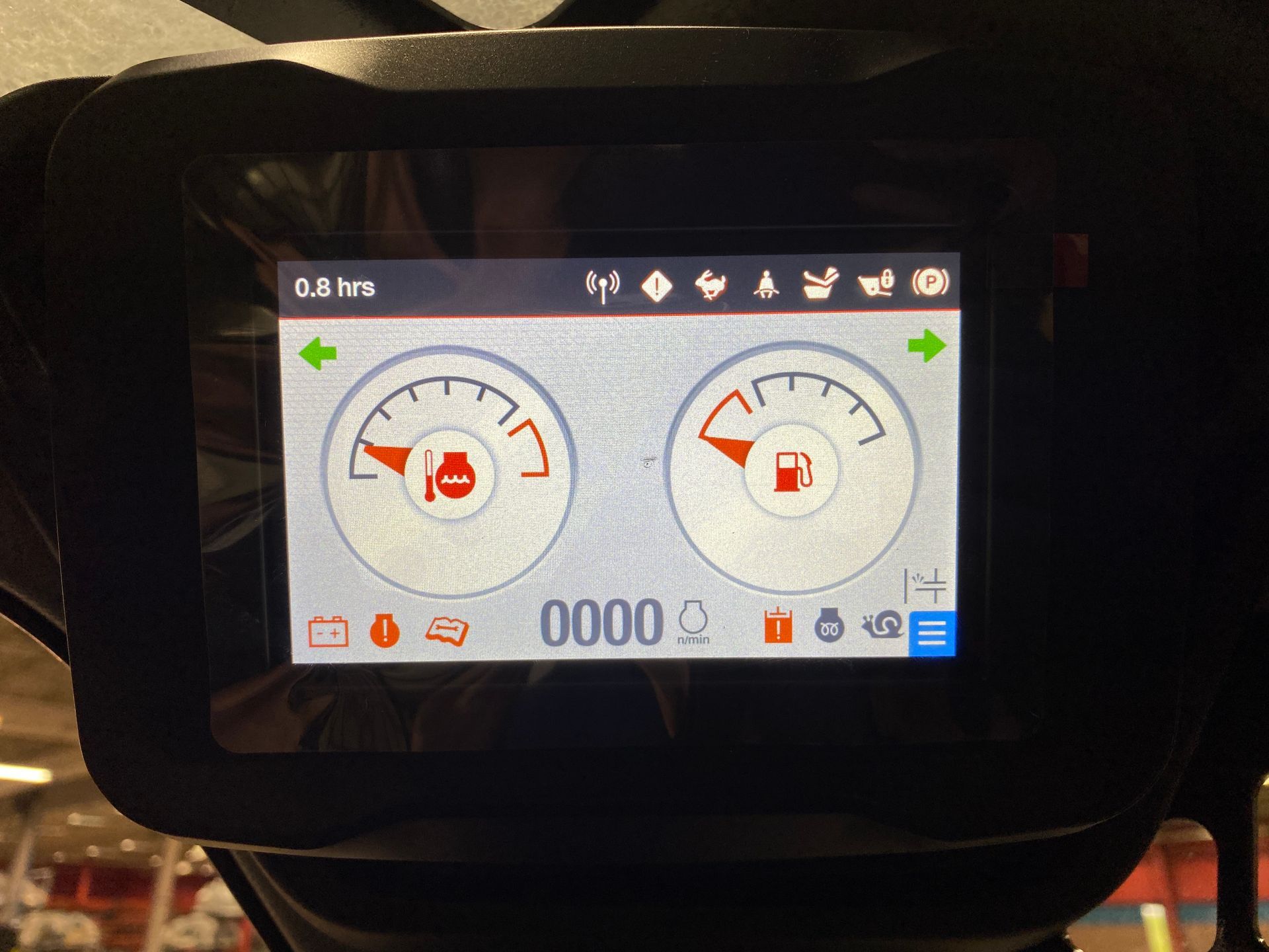 Digital dashboard with gauges, fuel and engine. Hours, warning lights, and menu icons are displayed.