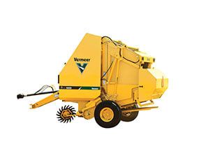 Yellow Vermeer baler on a white background.