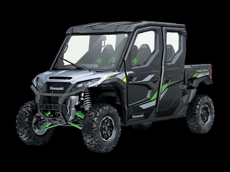 Black and green Kawasaki side-by-side UTV with four doors and a truck bed, against a black background.