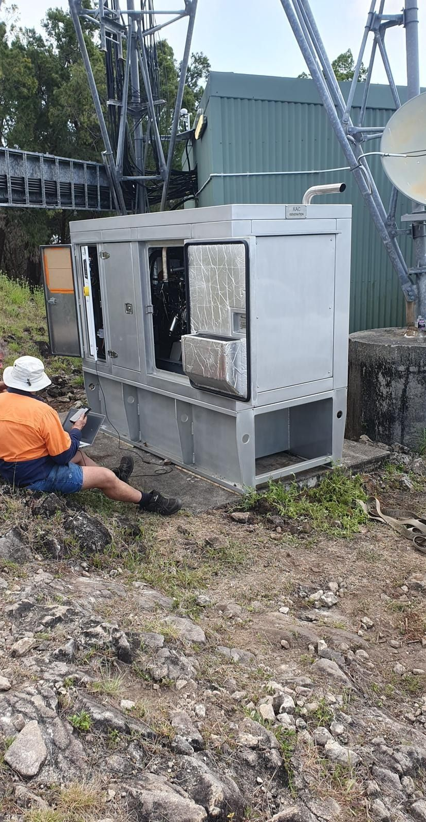 Orange and Black Portable Generator on a Brick Surface — KAC Generation & Mechanical Pty Ltd In Bungalow, QLD