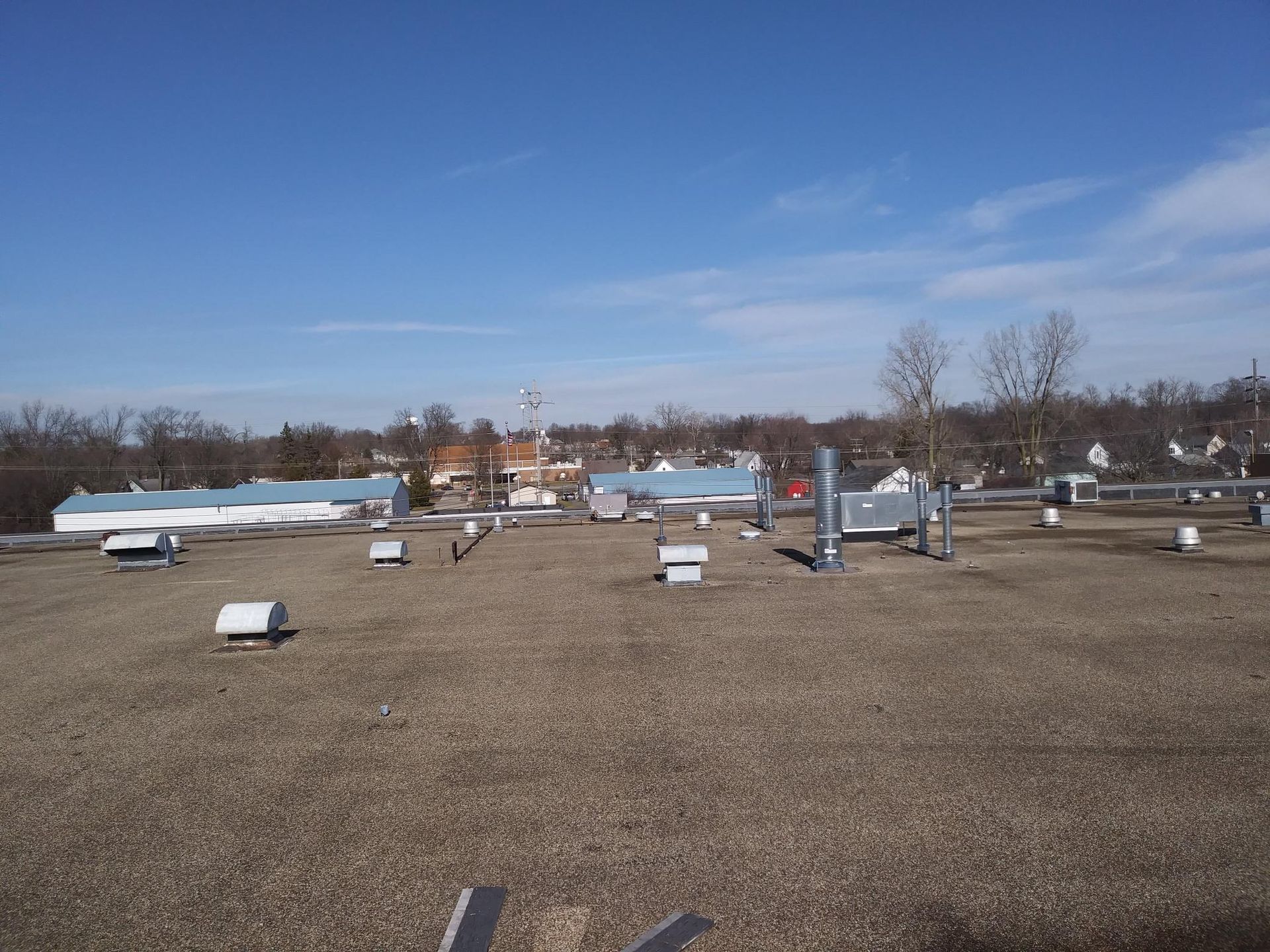 The roof of a building with a lot of vents on it