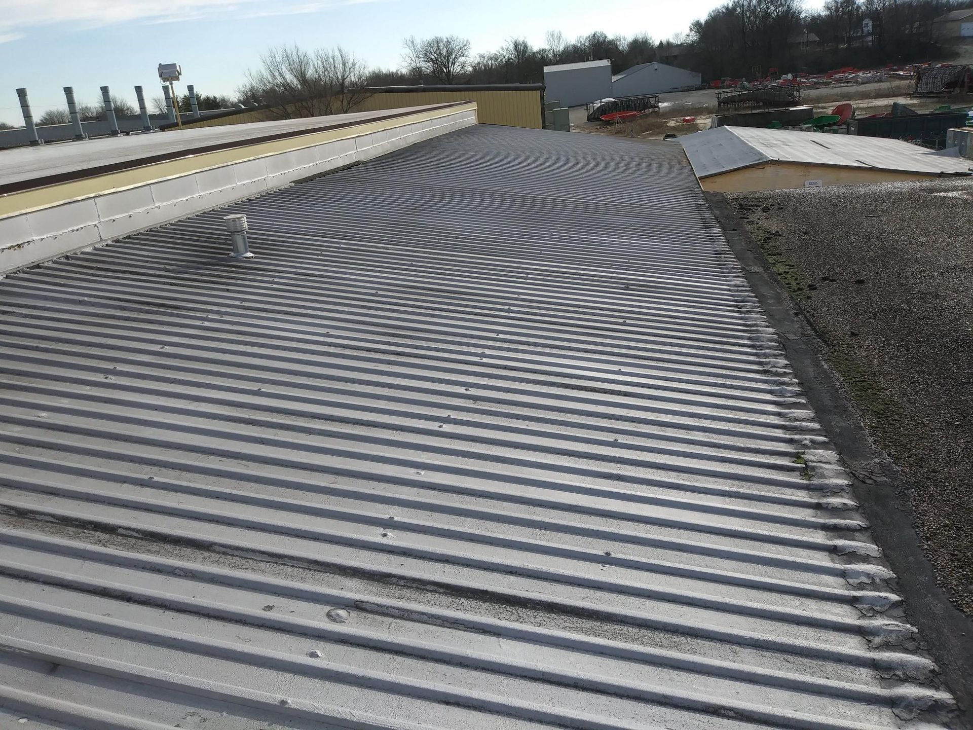 A close up of a metal roof with a chevron pattern