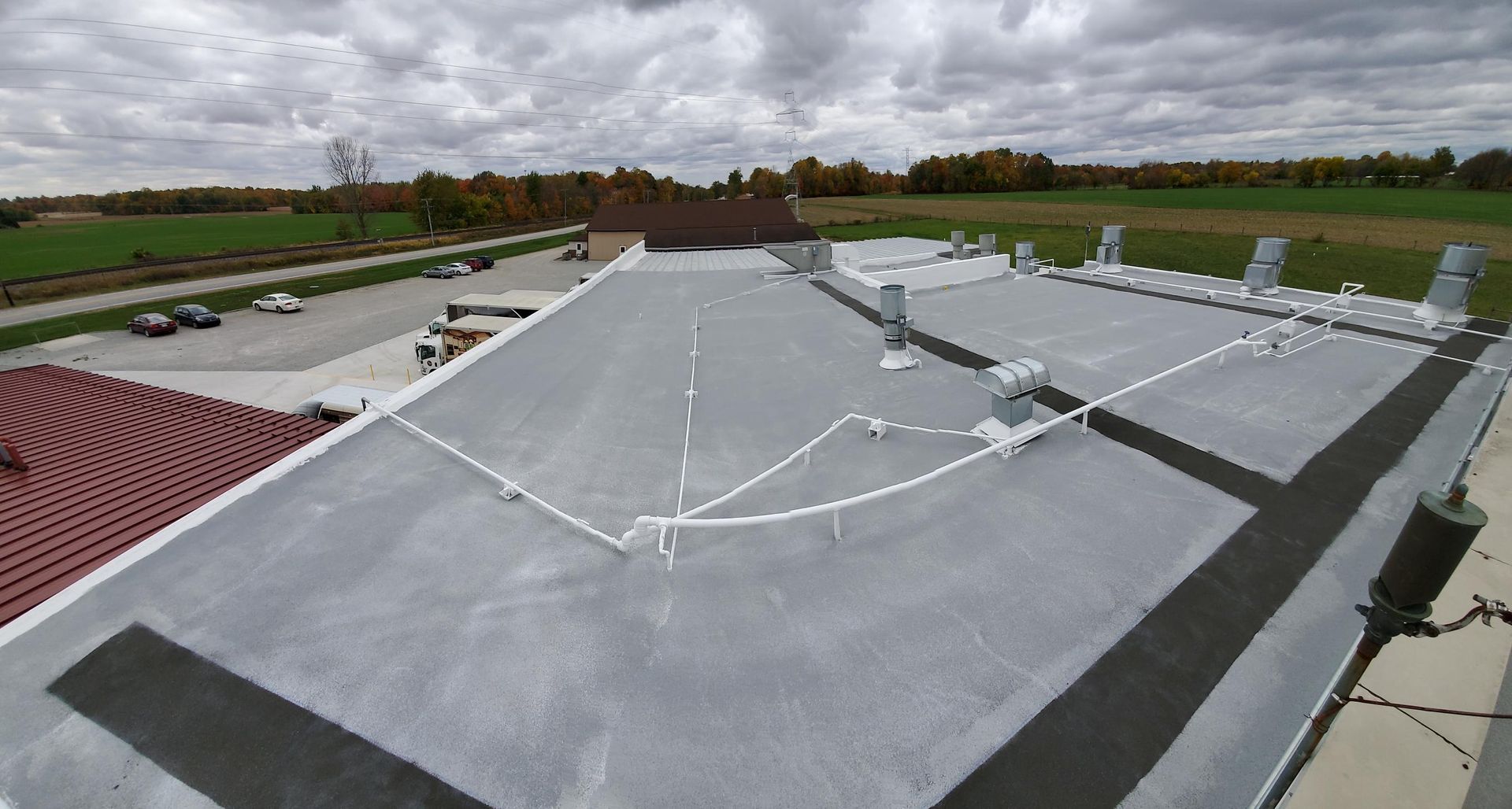 The roof of a building with a lot of wires on it.