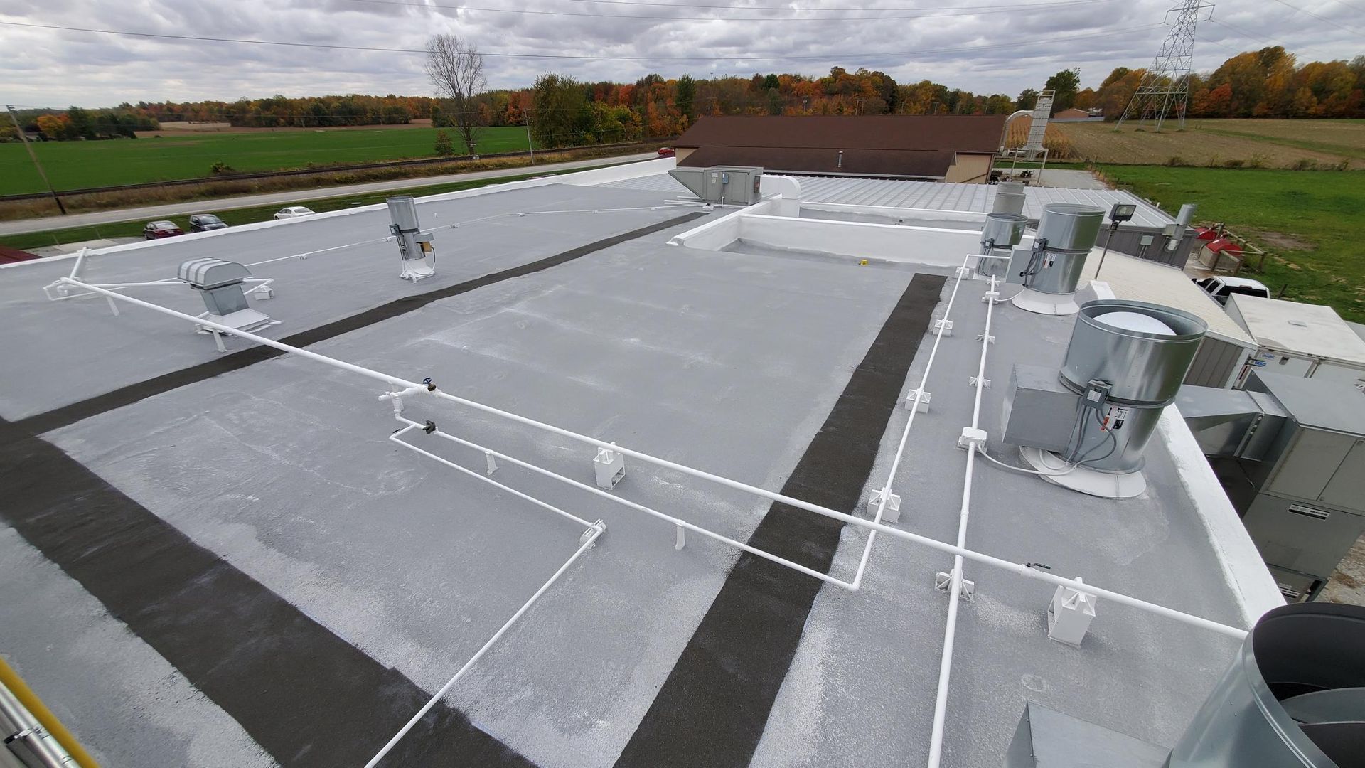 An aerial view of a roof with a lot of wires on it.