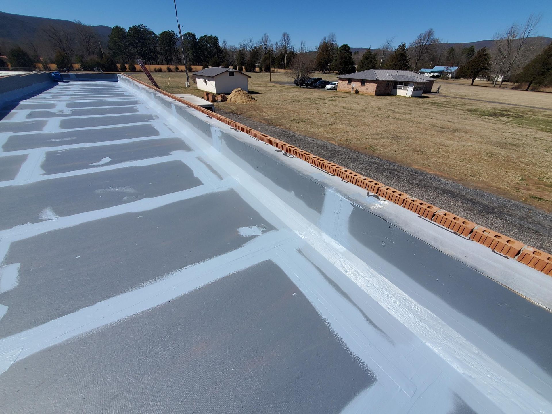 A roof that has been painted grey and white
