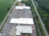 An aerial view of a large industrial area with lots of buildings and trees.