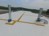 A white roof with a lot of pipes on it.