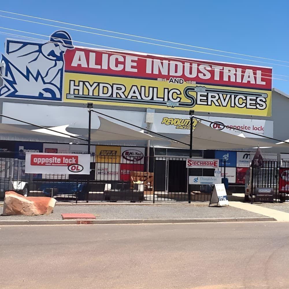 A Building With A Sign That Says Alice Industrial Hydraulic Services — AHT Towing in Ciccone, NT