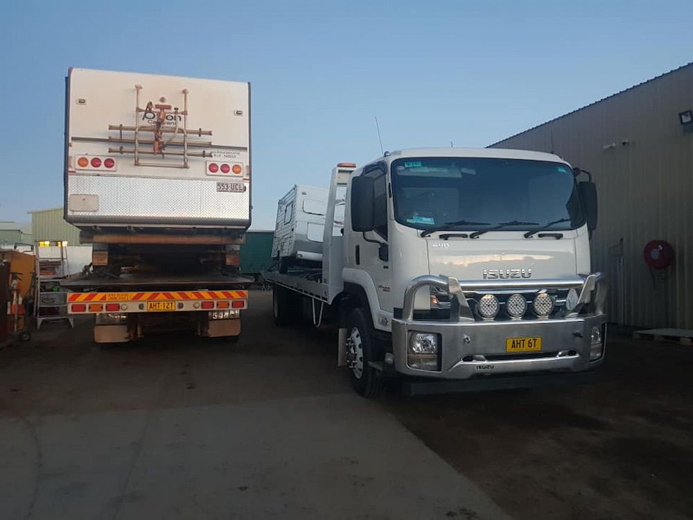 Two Trucks Are Parked Next To Each Other In A Parking Lot — AHT Towing in Ciccone, NT