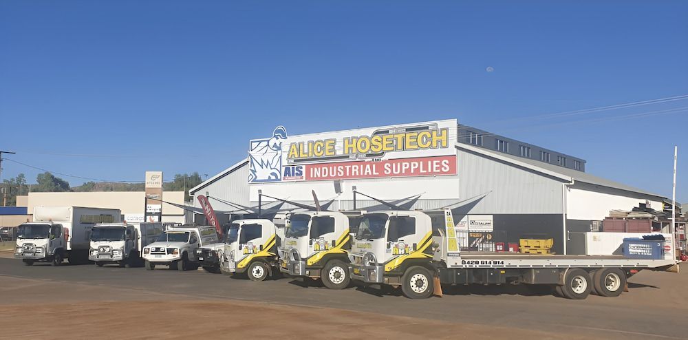 Two Men Are Shaking Hands In A Store — AHT Towing in Ciccone, NT