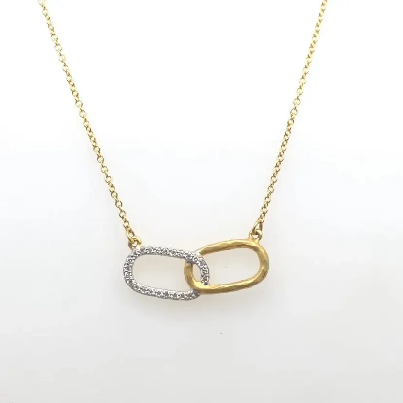 Gold chain necklace with interlocked silver and gold oval links on a white background