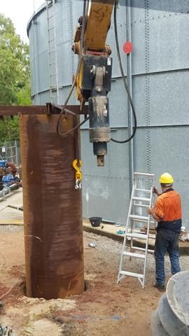 Man is Standing Next to a Ladder and a Crane — Sape Industries in Garbutt, QLD