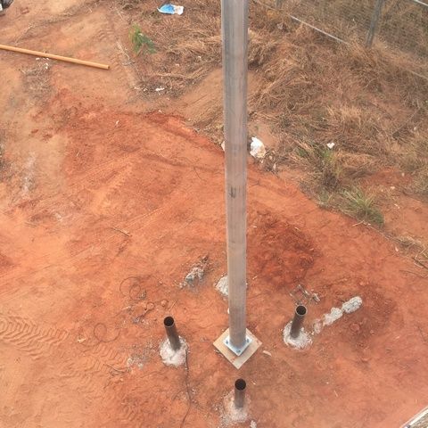 An Aerial View of a Pole in the Middle of a Dirt Field — Sape Industries in Garbutt, QLD