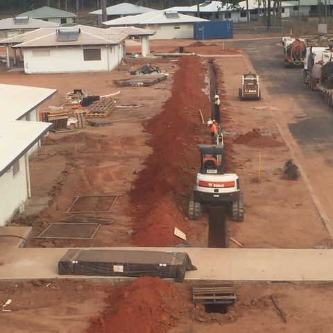Aerial View of a Construction Site With a Bobcat in the Foreground — Sape Industries in Garbutt, QLD