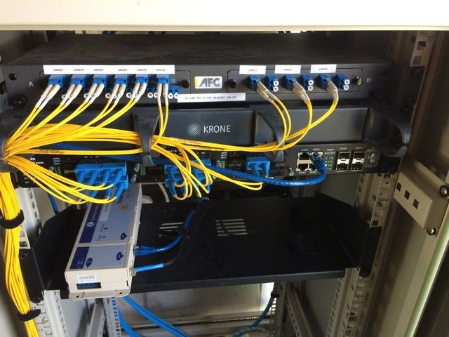 The Back of a Krone Server With Lots of Wires Coming Out of It — Sape Industries in Garbutt, QLD