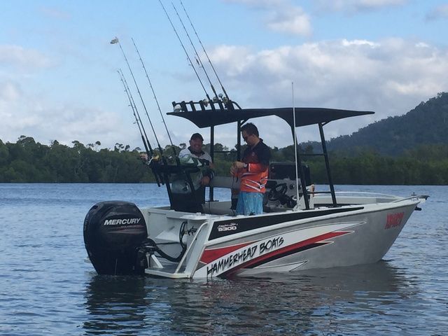 Two Men Are Fishing on a Boat That Says Mercury on the Side — Sape Industries in Garbutt, QLD