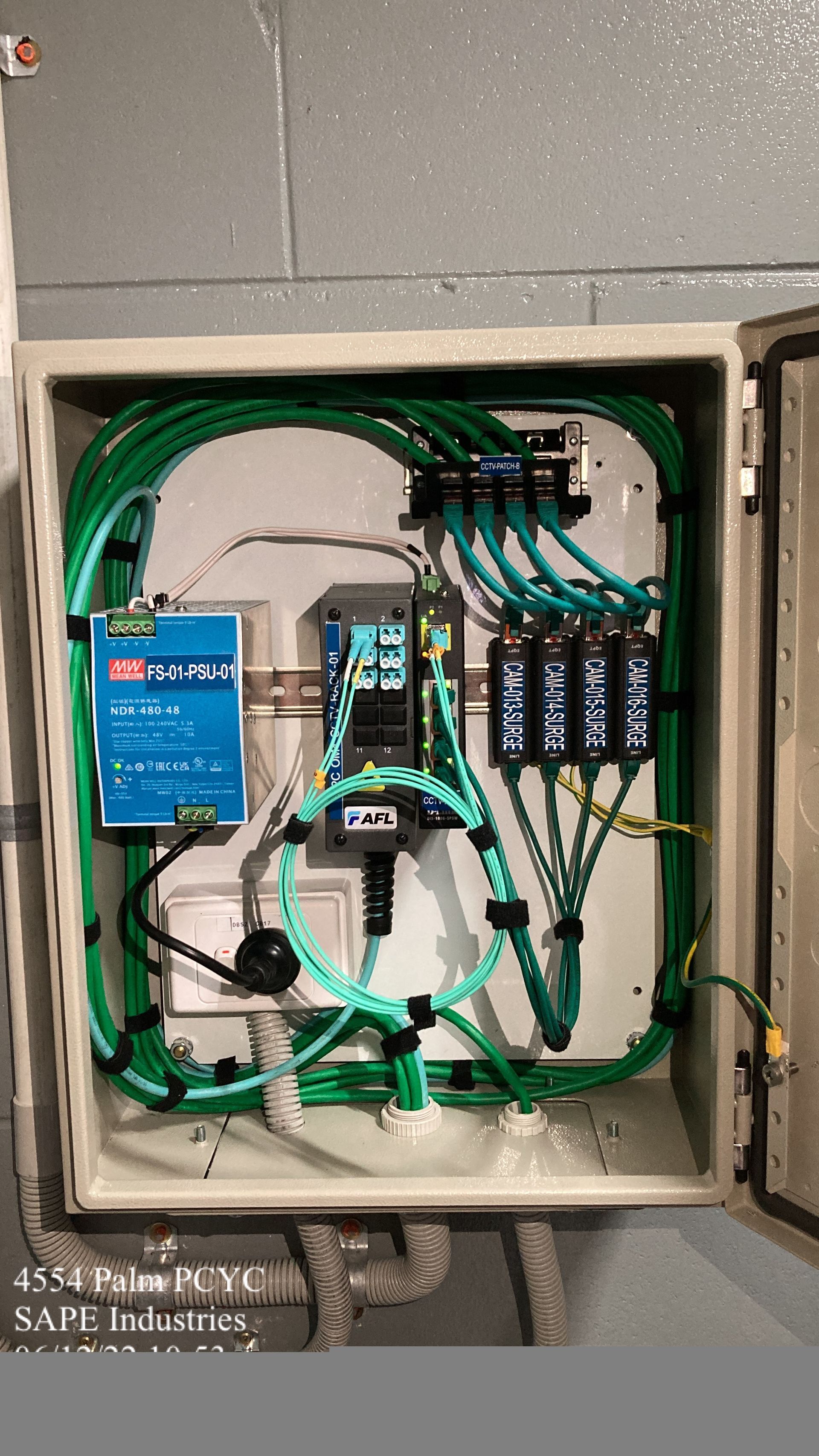A box with a lot of wires coming out of it.