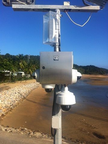 Stainless Steel Box is Mounted on Top of a Pole Next to a Beach — Sape Industries in Garbutt, QLD