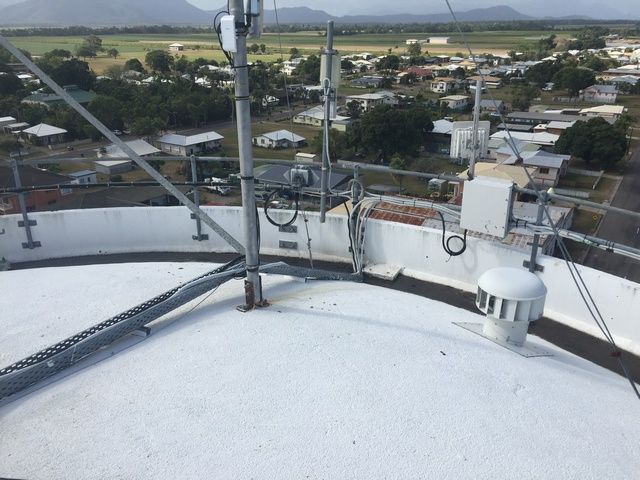 White Roof With Antennas and a Chimney on It — Sape Industries in Garbutt, QLD