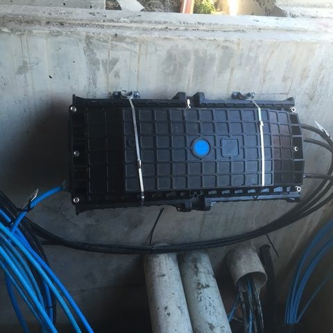 Black Electronic Box With a Blue Button on It — Sape Industries in Garbutt, QLD