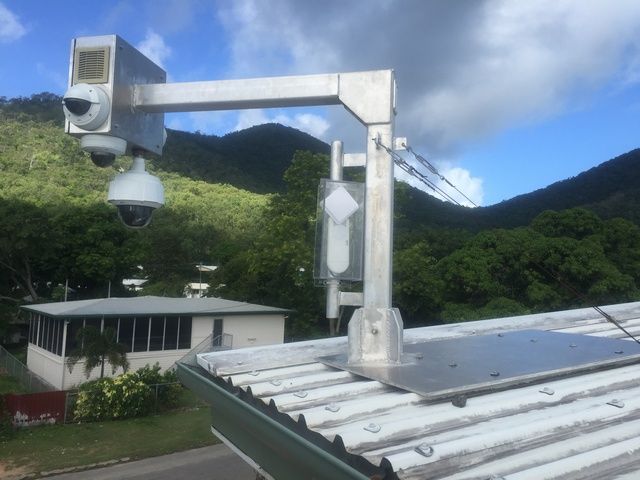 Camera is Mounted on the Roof of a Building With Mountains in the Background — Sape Industries in Garbutt, QLD