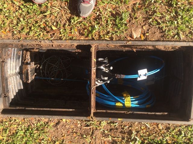 Person is Standing Next to a Box With a Bunch of Wires in It — Sape Industries in Garbutt, QLD