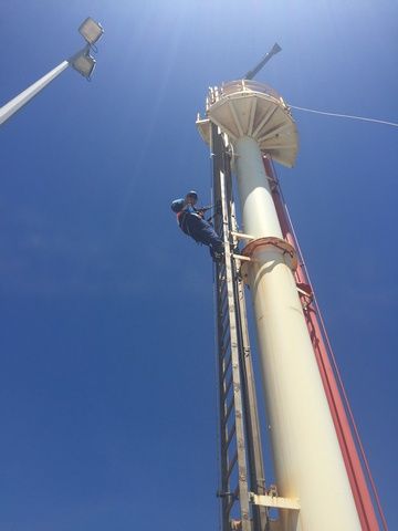 Man is Climbing Up the Side of a Tall Building — Sape Industries in Garbutt, QLD