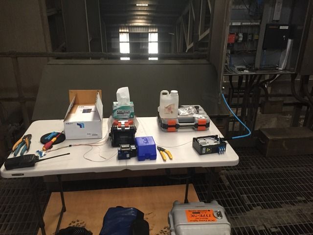 Table With a Lot of Tools and Boxes Placed on It — Sape Industries in Garbutt, QLD