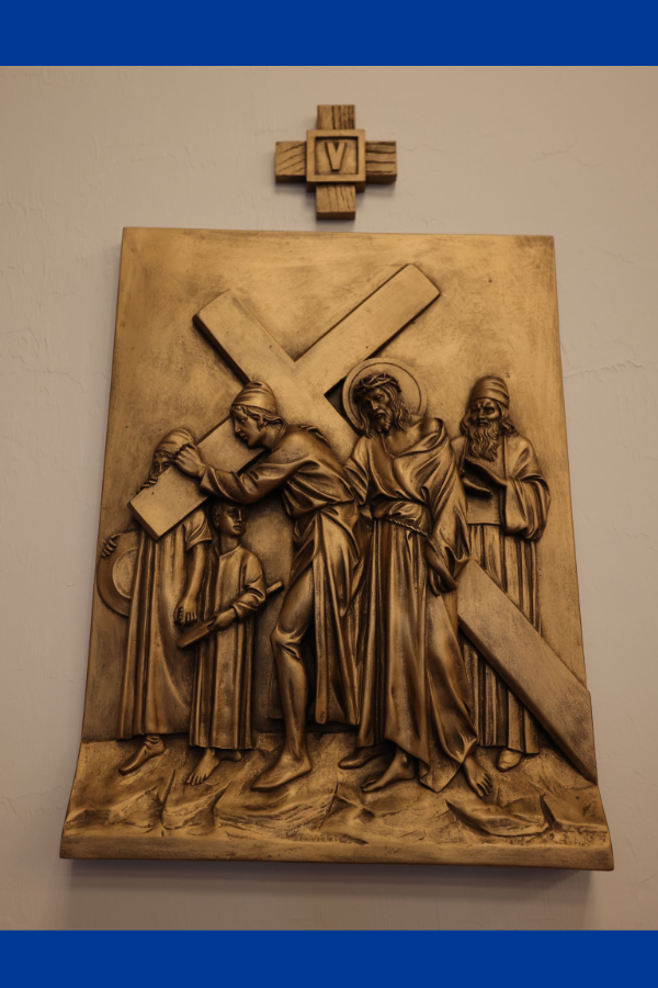 Simon of Cyrene lifts the cross to assist Jesus along the path to Golgotha.